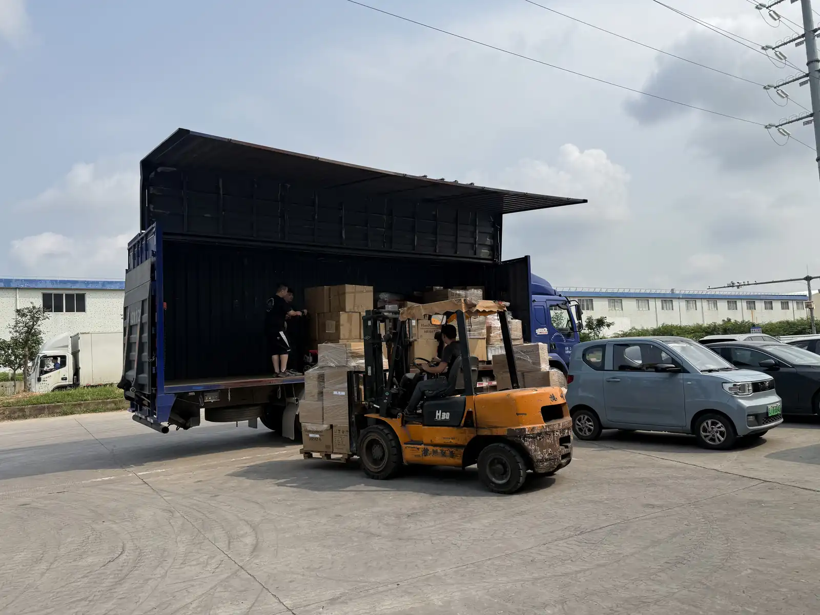 Cookware samples being loaded from the factory for the 139th Canton Fair