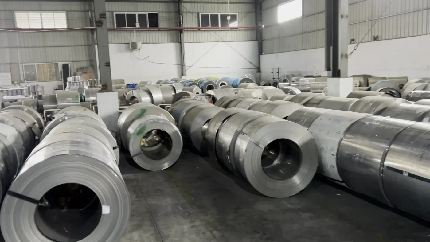 Stainless steel coil material stored at a cookware factory for production traceability