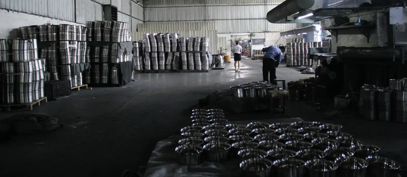 Work in progress stainless steel cookware bodies stored inside Jiangmen cookware factory