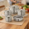 GS-01605-9PC tri-ply stainless steel cookware set in family kitchen scene