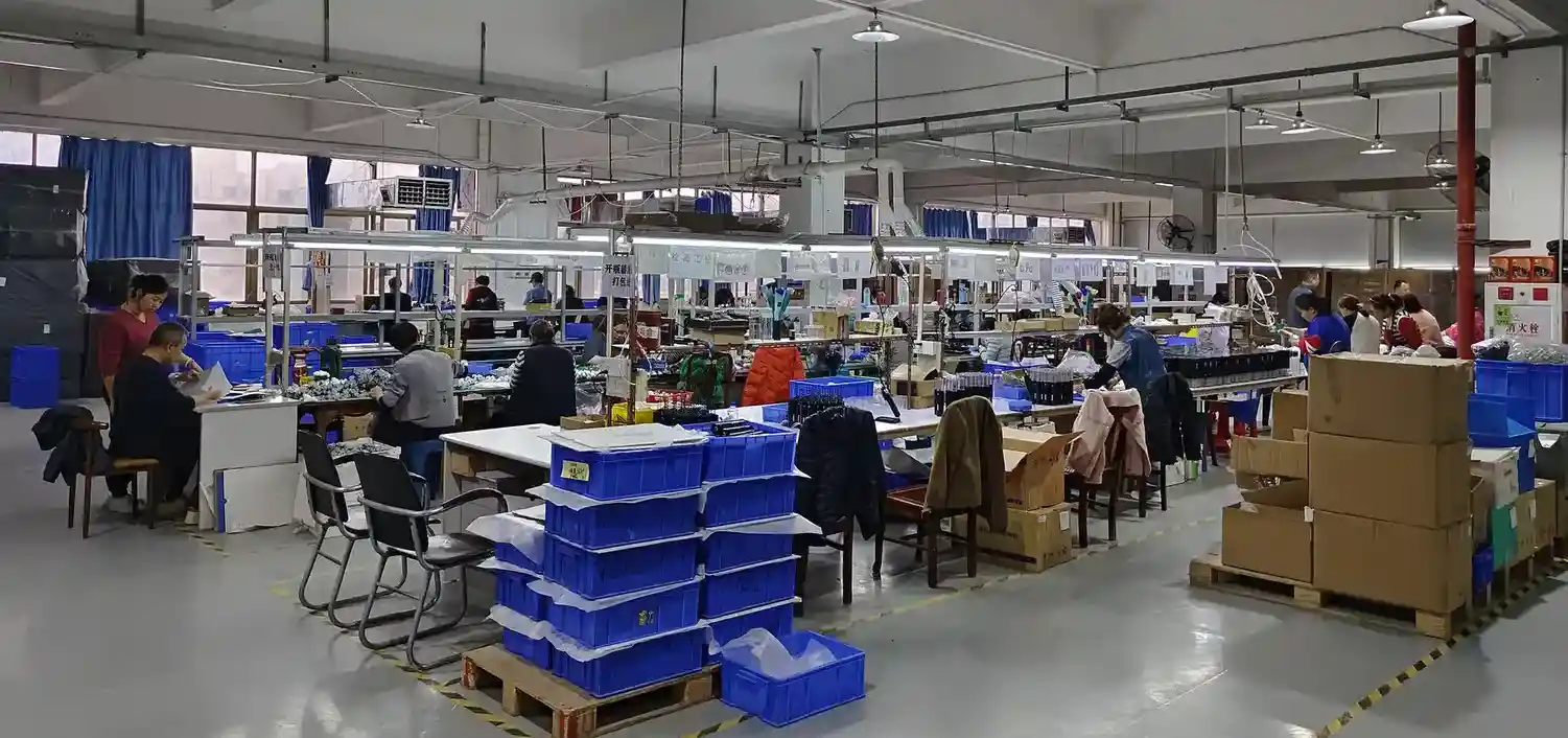Cookware assembly workshop with workstations and shipping cartons for supplier capability verification