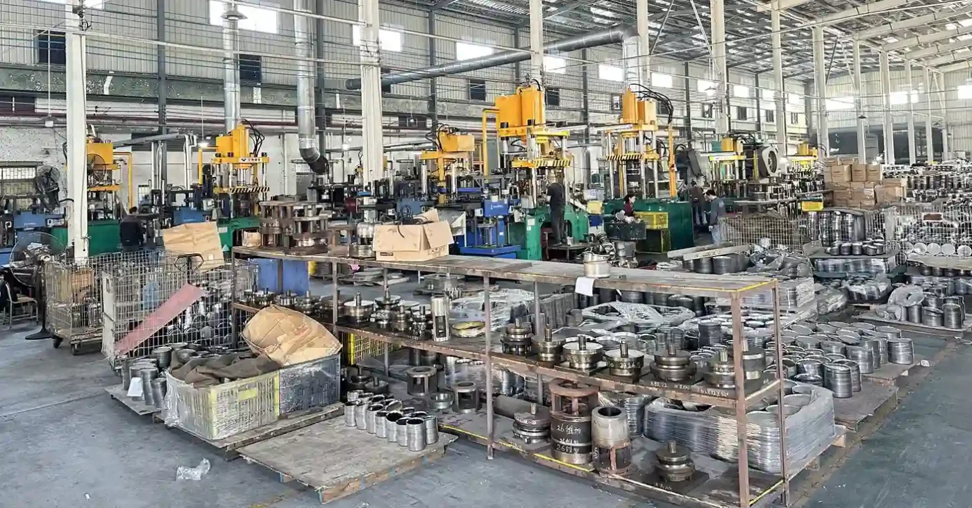 Goldensea Jiangmen cookware-forming workshop with hydraulic presses and work-in-progress components for supplier verification