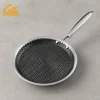 GS-01601EN-CP shallow stainless steel pizza pan and crepe pan with long handle on a gray studio surface