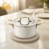 Cream ceramic-coated casserole pot with gold-plated handles, glass lid, and integrated pouring spout GS-01690-WG-CA