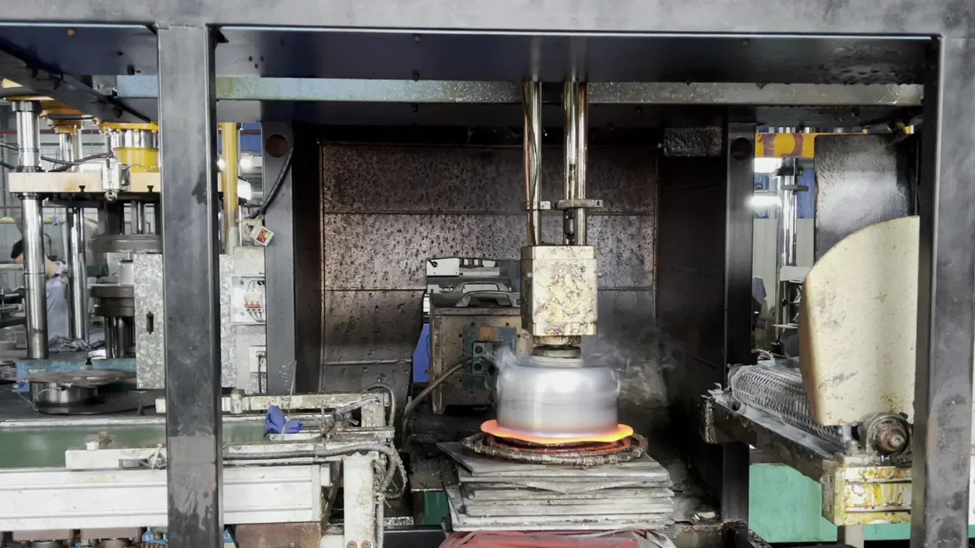 Stainless steel cookware body undergoing factory annealing